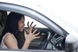 Photo: Angry female driver driving a car Angry female driver driving a car