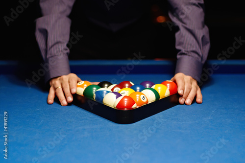 Photo: Hands on billiard balls Hands on billiard balls