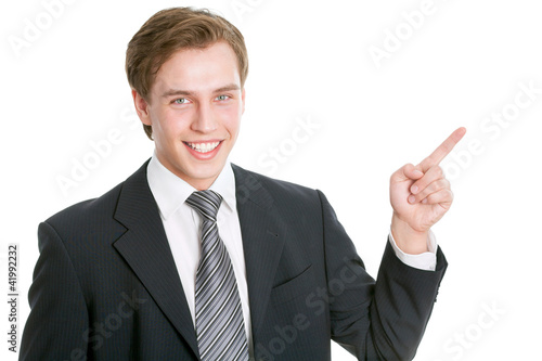 Photo: Business man pointing showing copy space Business man pointing showing copy space