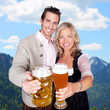 Heaven of bavaria - couple having a beer - clinking glasses