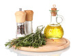 Oil in a bottle and fresh rosemaryon wooden board isolated