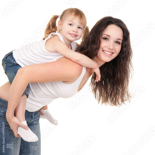 Photo: Happy mother and daughter playing on the white background Happy mother and daughter playing on the white background