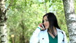 Pretty young female having a conversation over the mobile