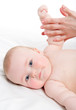 Mother massaging her lovely baby