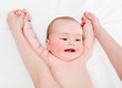 Mother massaging her lovely baby
