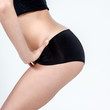 Photo: Hanche de femme mince de profil en boxer noir Hanche de femme mince de profil en boxer noir