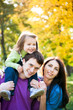 Family playing in autumn