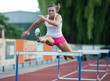 Professional female hurdler during training