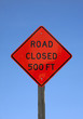 Road closed five hundred feet sign