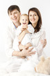 Photo: Happy family holding smiling baby over white background Happy family holding smiling baby over white background