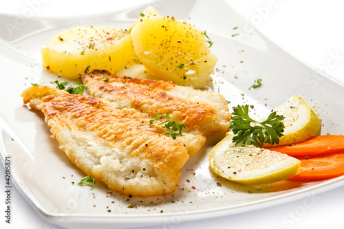 Photo: Fish dish - fried fish fillet with vegetables Fish dish - fried fish fillet with vegetables