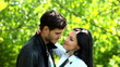 Young attractive couple in love at a park