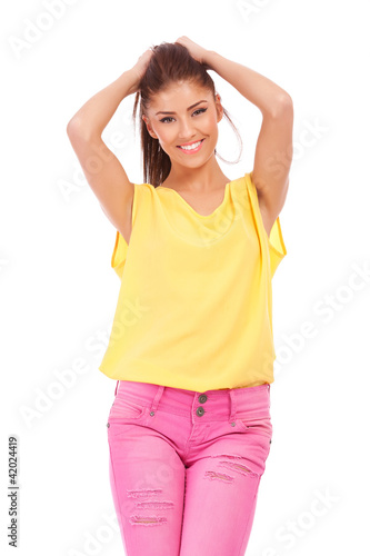Photo: woman with her hands in her hair woman with her hands in her hair