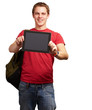 portrait of young man holding a digital tablet over white backgr