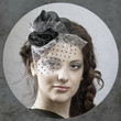 old-fashioned portrait of the young  girl in hat with veil.