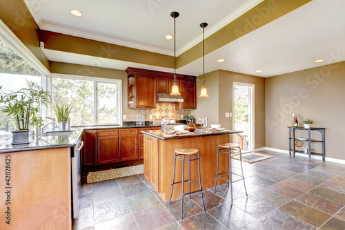 Photo: Luxury kitchen interior with green walls and stone floor. Luxury kitchen interior with green walls and stone floor.