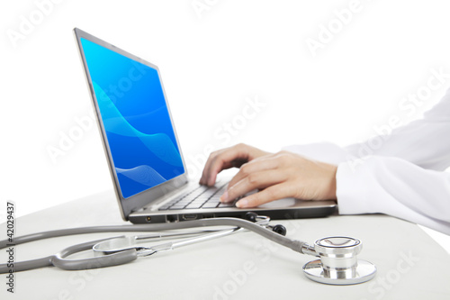 Photo: Doctor working with laptop Doctor working with laptop