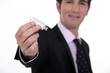 businessman holding a flash drive