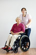 Senior woman and aid or nurse