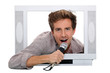 Man singing inside television