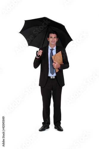 Foto: banker with umbrella isolated on white banker with umbrella isolated on white