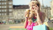 Video: Woman with shopping bags talking on the phone, steadicam shot Woman with shopping bags talking on the phone, steadicam shot