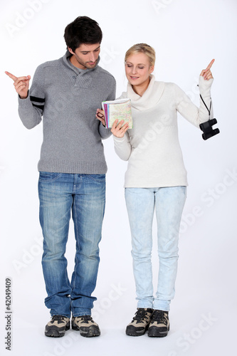 Photo: Couple reading a map Couple reading a map