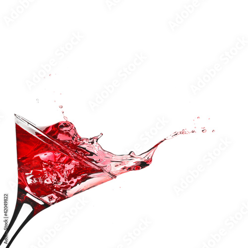 Photo: Red cocktail with splash isolated on white Red cocktail with splash isolated on white