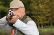 Hunter looking down the barrel of a gun