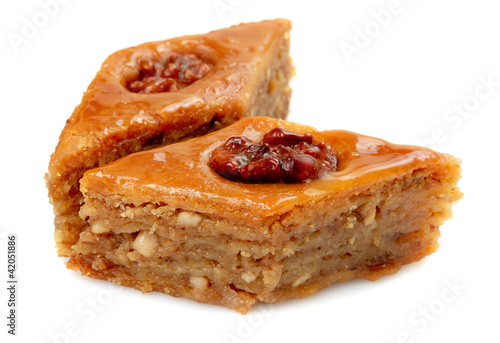 Photo: Oriental sweets baklava on a white background Oriental sweets baklava on a white background