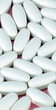 white pill on pink background