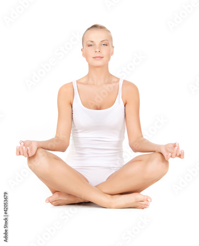 Photo: woman in cotton undrewear practicing lotus pose woman in cotton undrewear practicing lotus pose