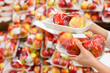 Foto: girl hands hold packed apples in store; girl hands hold packed apples in store;