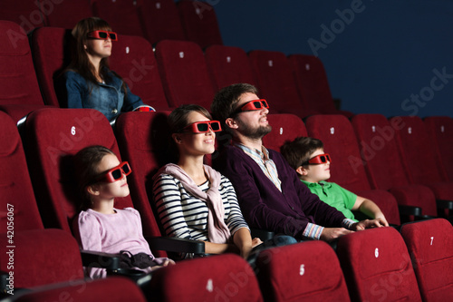 Photo: Young family in the movie theater Young family in the movie theater