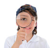 boy looking through a magnifying glass