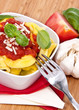 Fresh Tortellini in a bowl on wooden background