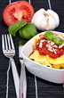 Tortellini with blurred ingredients in the background