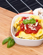 Tortellini in a bowl with ingredients