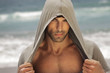 Sexy man in hood outdoors