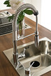 Photo: Modern kitchen counter, sink with flowers Modern kitchen counter, sink with flowers