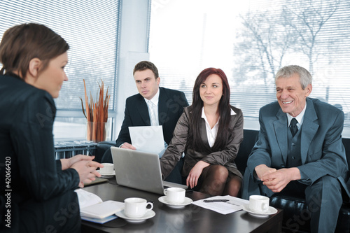 Foto: Businesswoman in an interview with three people Businesswoman in an interview with three people