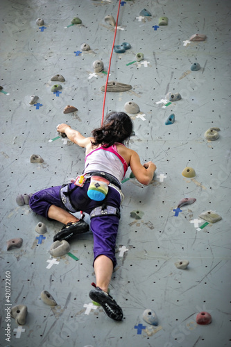 Photo: Girl doing rock climbing Girl doing rock climbing