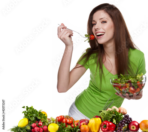 Photo: Woman with salad isolated on white Woman with salad isolated on white