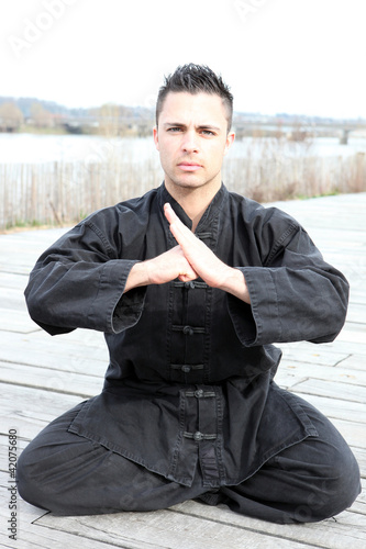 Photo: Man practising martial arts outdoors Man practising martial arts outdoors