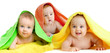 Adorable babies group covered by colorful towels