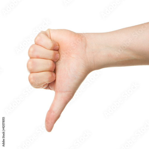 Photo: Image of a womans hand showing thumb down Image of a womans hand showing thumb down