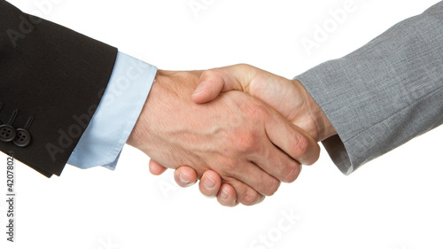 Photo: Businessman and businesswoman shaking hands Businessman and businesswoman shaking hands
