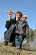 Father and son about to launch a toy plane