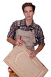 Carpenter holding cupboard door