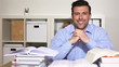 Portrait of happy student smiling behind books